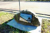 The Malcolm Hahn memorial sits outside the tennis court he fought so hard to get